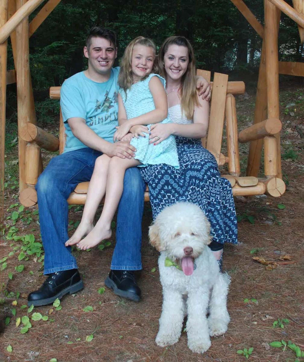 Family with labradoodle puppy in NH